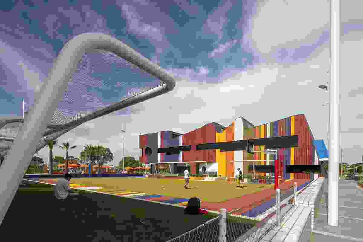 Extending through the landscape of the basketball court, the glazed brick facade of the hub building references the flags of Springvale’s multicultural population.