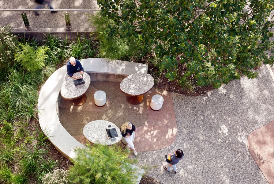 Small seating areas are formed from rammed-earth furniture using soil reclaimed from the site.