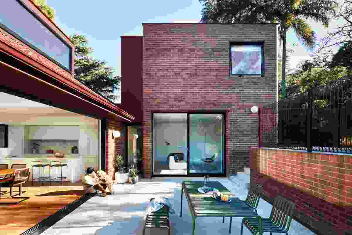 Beautifully detailed with bullnose corners and brick-clad reveals, the new “children’s tower” is connected physically to the courtyard and visually to the main hub of the home.