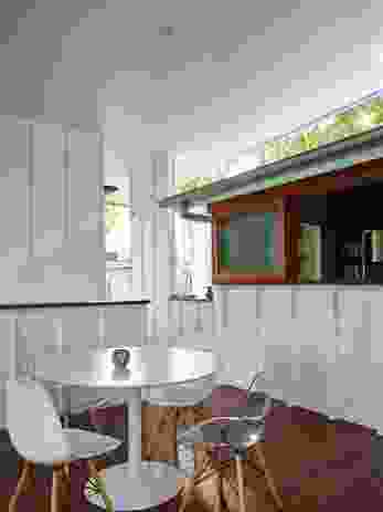 A long sliding window provides a servery that connects the kitchen to the covered deck.