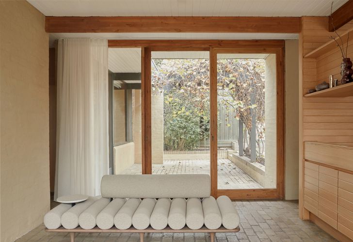 The new work has preserved the architectural language and material warmth of the original residence.