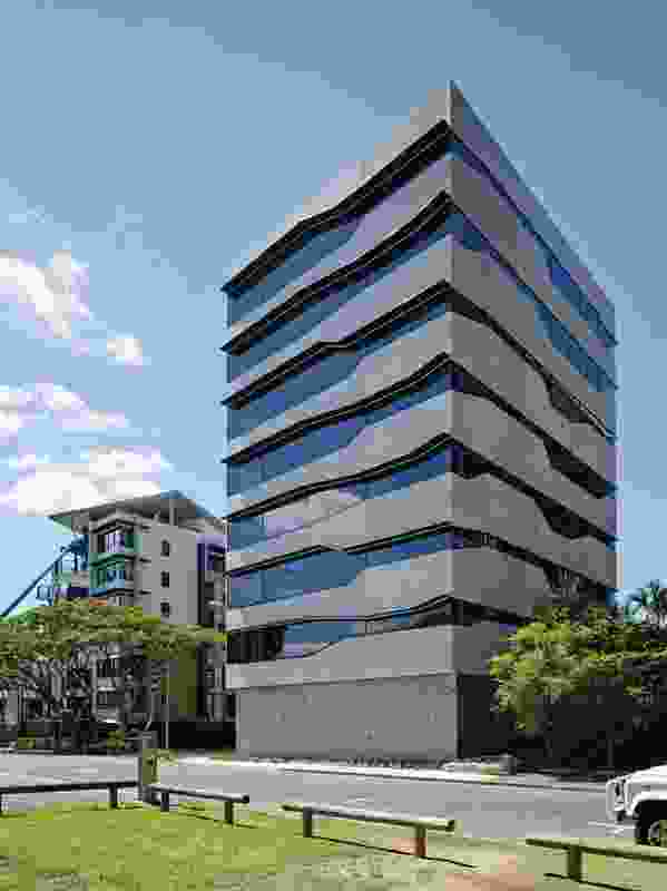 With its precast concrete and black-tinted windows, the building’s function is ambiguous.