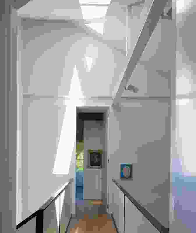 A bridge links the bedrooms. Artwork: Roslynd Piggott (foreground), Clarice Beckett (background).