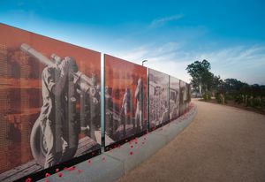 Visitors can leave poppies at the wall in remembrance.
