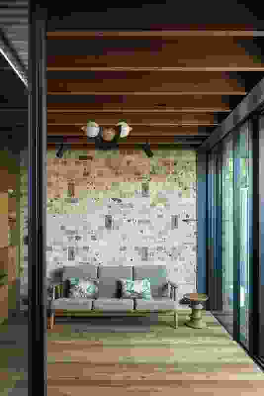 Recycled convict-era bricks were used in the construction of a living room wall.
