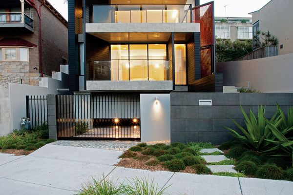 The exterior palette of black-stained jarrah, concrete and copper is continued indoors.