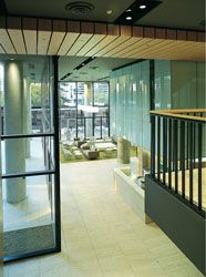 The multi-volumed
public space of the podium. Here the cafe and lounge
are seen from the mezzanine level. 