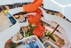 Made of roughly 34 tonnes of steel, the stairwell twirls effortlessly above a garden bed.