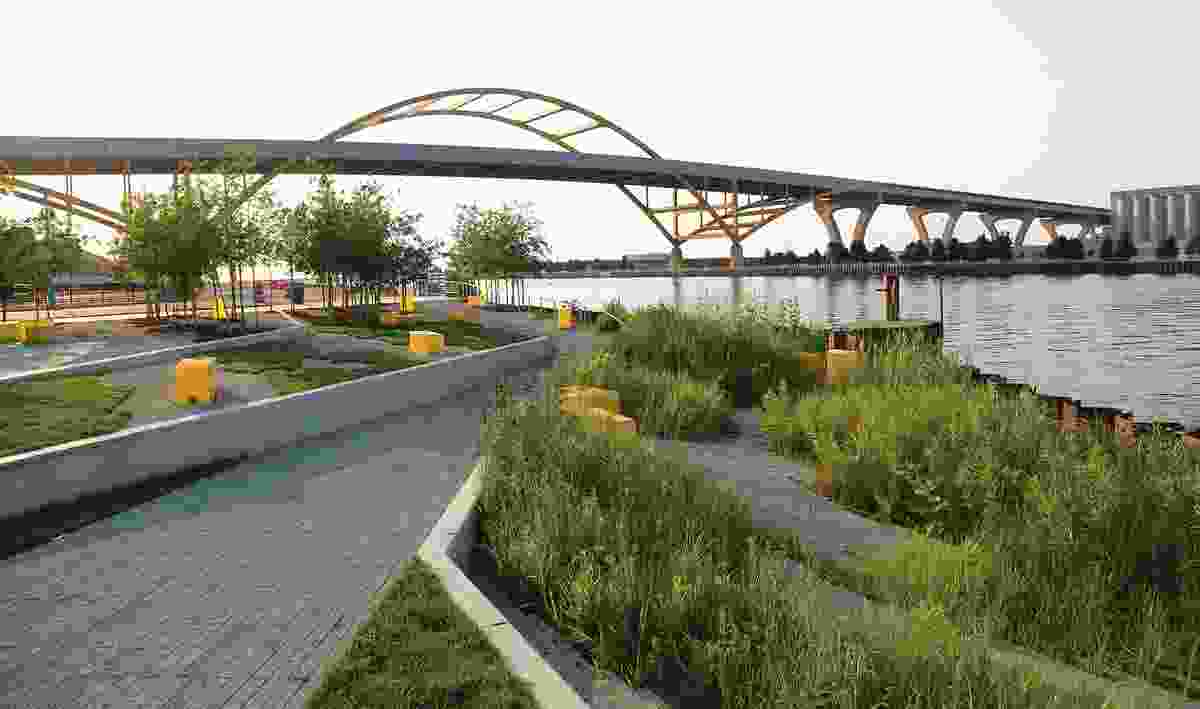 Designed by Stoss Landcape Urbanism, the Erie Street Plaza in Milwaukee, Wisconsin, can accommodate a wide variety of possible activities in addition to registering environmental cycles through a reconstituted marsh.