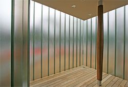 The day-lit lobby features a single column cased in timber.