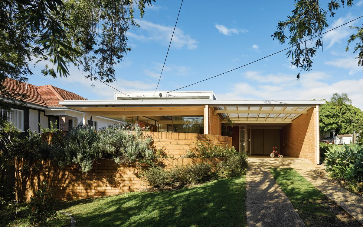 Circular brick walls provide a sense of permanence and solidity, while suggesting a house emerging from its site.