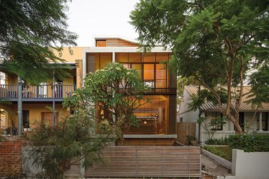 The architect rejected a car spot, retaining a large frangipani tree at the front instead.