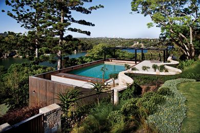 The pool forms the roof of a pavilion resting on a sandstone outcrop, deep within a mixture of magnificent money-puzzle trees.