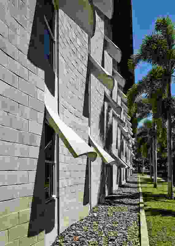 The material rhetoric of the building draws on the legacy of James Birrell’s work at the JCU Townsville campus, including the Humanities and Administration Building (now the Ken Back Chancellery).