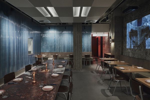 Industrial materials and low lighting create a dramatic feel at Alfie's.