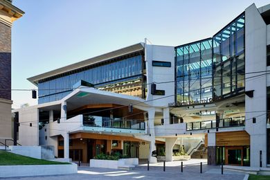 The building’s breezeway is a climactic space that “folds” the building inside out and forms a new heart for the university campus.