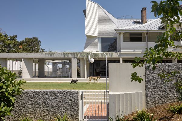 The delicate timber structure of the old Queenslander house has been rotated 90 degrees and raised onto concrete stumps.