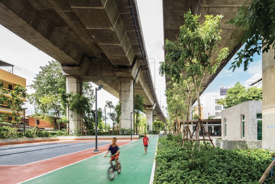 At Lankila pat 2 in Bangkok children cycle along a section of the ten-kilometre fitness route designed by Shma under the expressway.