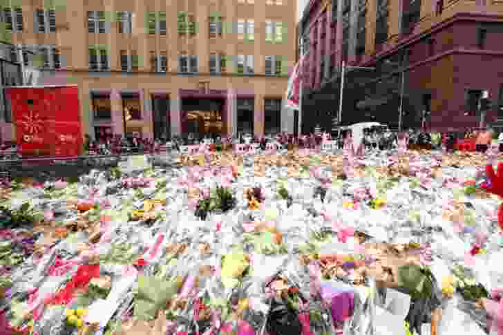 Public tributes for the 2014 Sydney hostage crisis in Martin Place by Kel O'Shea, licensed under  CC BY 2.0