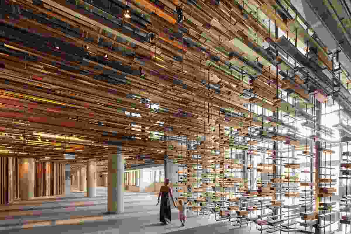 Designed by March Studio, the dramatic entry stair was constructed from more than 2150 pieces of recycled timber.