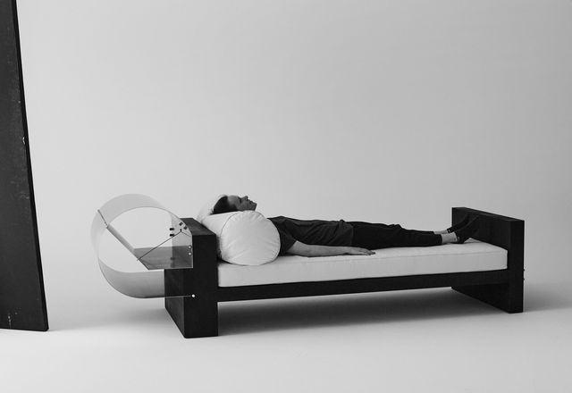 Olivia Bossy reclining on her No. 0422 daybed.