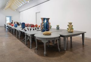 In the main gallery, the vessels are displayed on a surface composed of forty-five tables designed by John Wardle Architects.