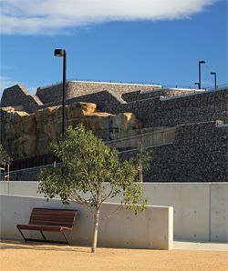 Looking west from The Point to the Ridge Terraces. The sandstone terrain has been reshaped with concrete retaining walls and gabions. Image: Christian Borchert