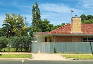The brick veneer house has a brilliant new addition.