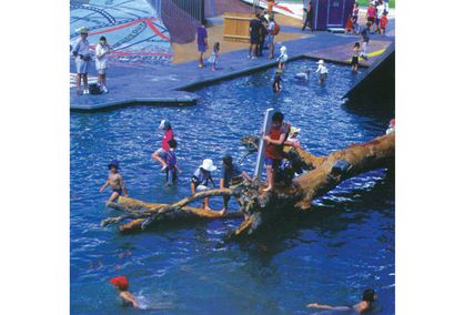 In an image from the early 2000s, children clamber over the inscribed and undulating topography – a practice disallowed by the museum today.