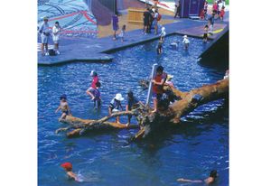 In an image from the early 2000s, children clamber over the inscribed and undulating topography – a practice disallowed by the museum today.