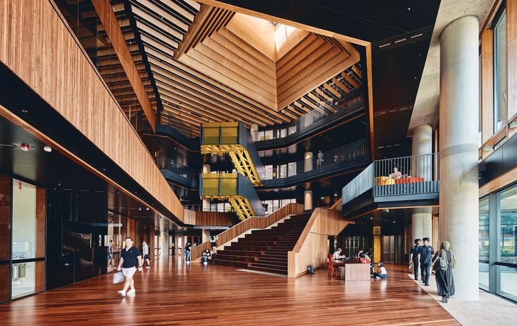 The triple-height atrium at the heart of the building includes a wide stair that doubles as bleachers, enabling the space to be used as an informal auditorium.