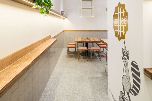 Natural timbers and Earth Honed terrazzo tiles in Waffee cafe.