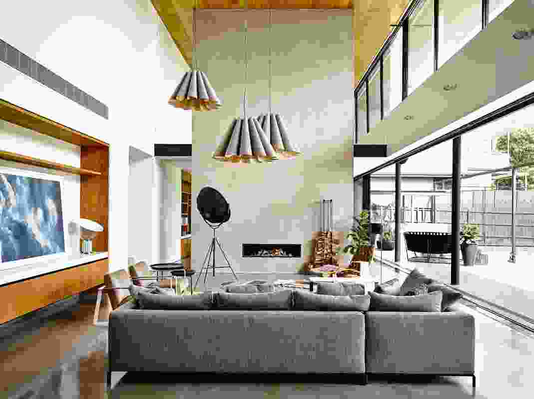 The double-height living area opens to the rear garden, the lofty space made to feel even more airy by its connection to the outdoors. Artwork: Susan Knight and Trevor Mein.