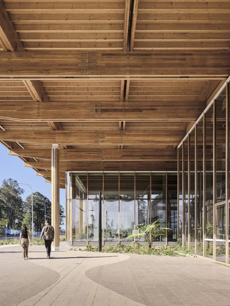 The building features extensive glazing, allowing for views both in and out.