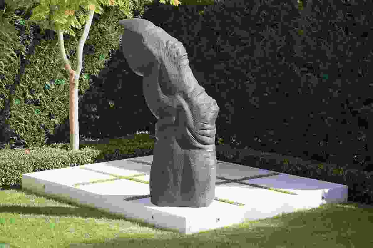 Chimpanzee Finger by Lisa Roet sits on a platform in the north Adelaide garden.