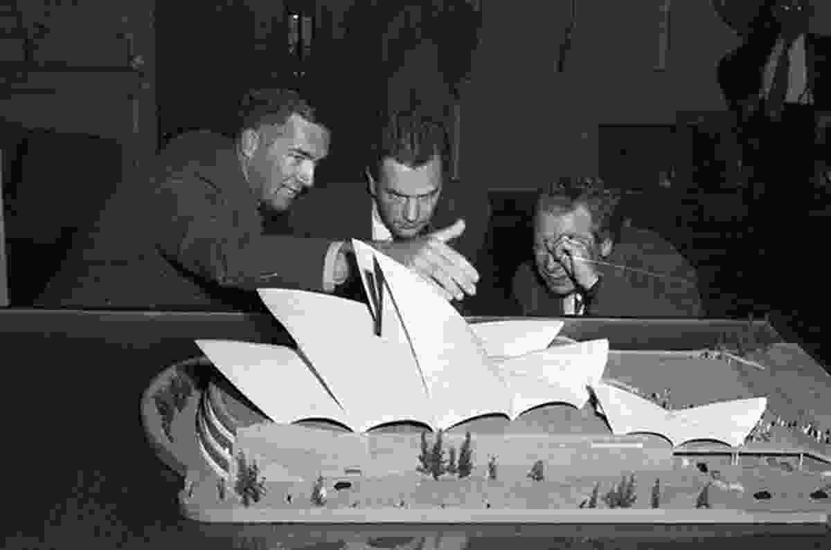 Jørn Utzon (left) presenting a model of the Opera House at Sydney Town Hall, 1957.