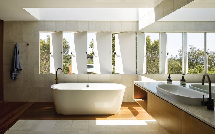 With skylights and gill-like windows, the bathing spaces give the illusion of being outside.