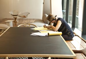 A female architect at work in BVN studio.