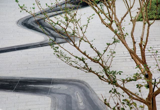 Yueyuan Courtyard by Z+T Studio explores the concept of erosion through the design of an intricate granite watercourse that flows through the space.