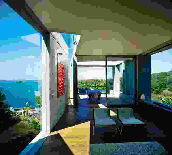 The living room tapers towards the dramatic cantilevered deck.