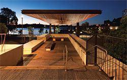 The canopy extends over the belvedere, transforming it into an elevated viewing platform. The timber-battened soffit above follows the section of the trusses. Image: Brett Boardman