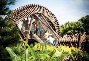 Visitors clamber through the fantastically twisty timber treehouse at the Ian Potter Children’s Wild Play Garden.