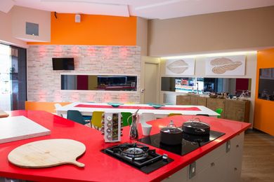 The Big Brother kitchen benches are Silestone Rosso Monza from Cosentino.