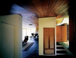 Looking down the length of the house, the living area is to the left and kitchen to the right. 