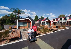 Shared pedestrian and vehicular space blurs ownership boundaries.