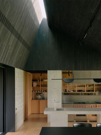 Robust and refined interiors feature oak joinery, steel fittings and charred timber.