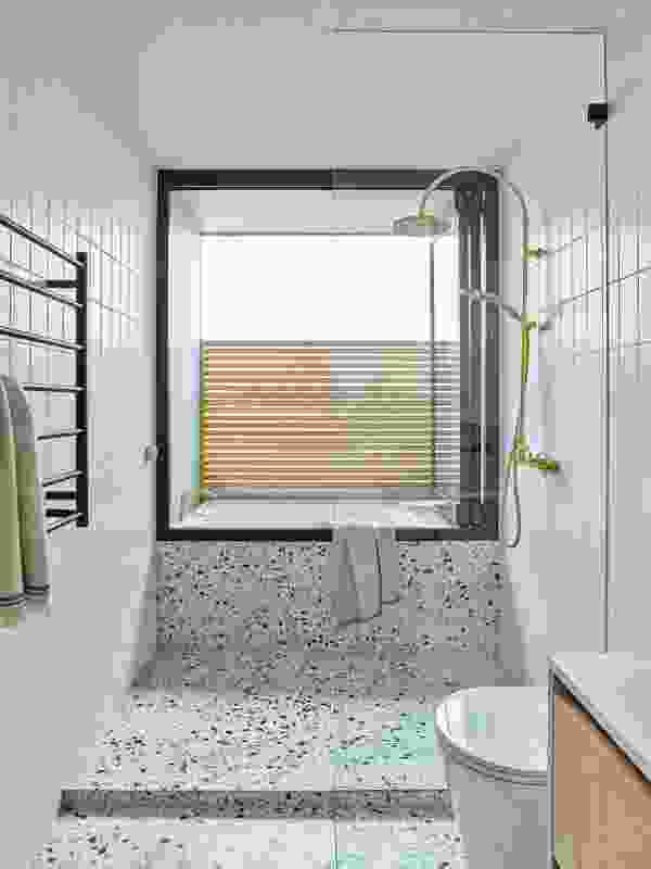 In the second-floor bathroom, a “balcony-bath” permits an outdoor bathing experience.