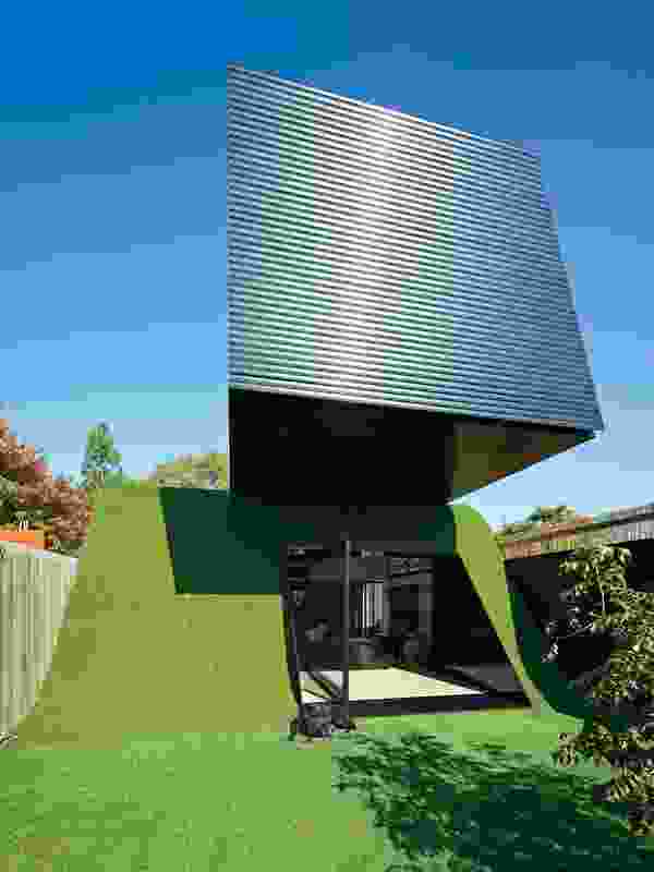 A hill clad in artificial turf topped with a cantilevered box forms the 2011 Hill House.