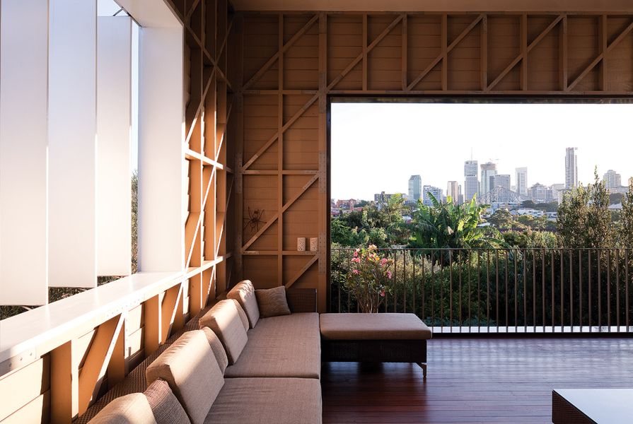 The new outdoor room features exposed bracing and deep shading, and carefully frames the city views beyond.