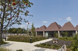 Like a collection of houses, pitched roofs – each with a skylight – gather above individual rooms